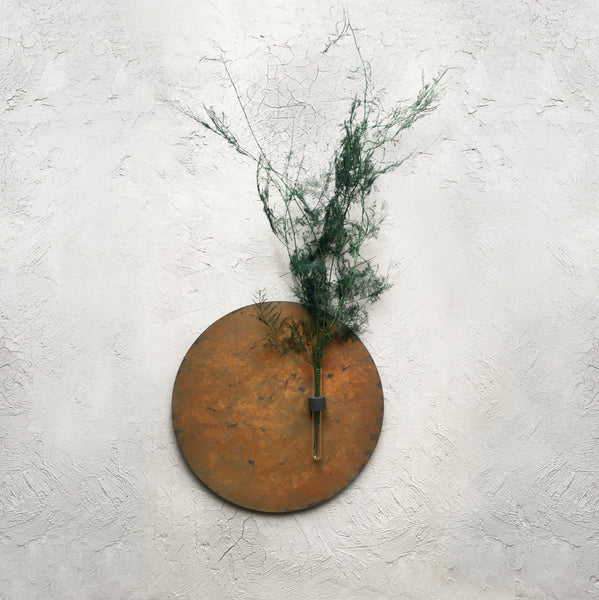 Circular planter in rust-effect wood